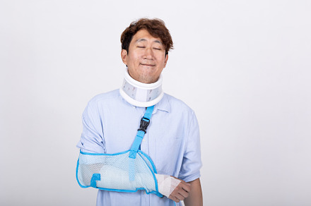 Asian man feeling relaxed eyes closed with broken arm and neck i