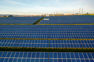 Drone view of blue solar panels on agricultural land during sunny day, a Photo by andreonegin market
