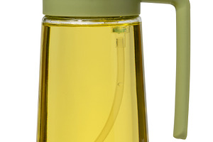 Kitchen bottle dispenser for vegetable oil with green cap on iso, a Food & Drink Photo by ndanko