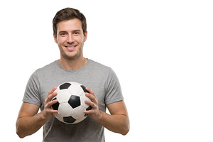 smiling young man with a soccer ball, a Sports & Recreation Photo by itakdalee