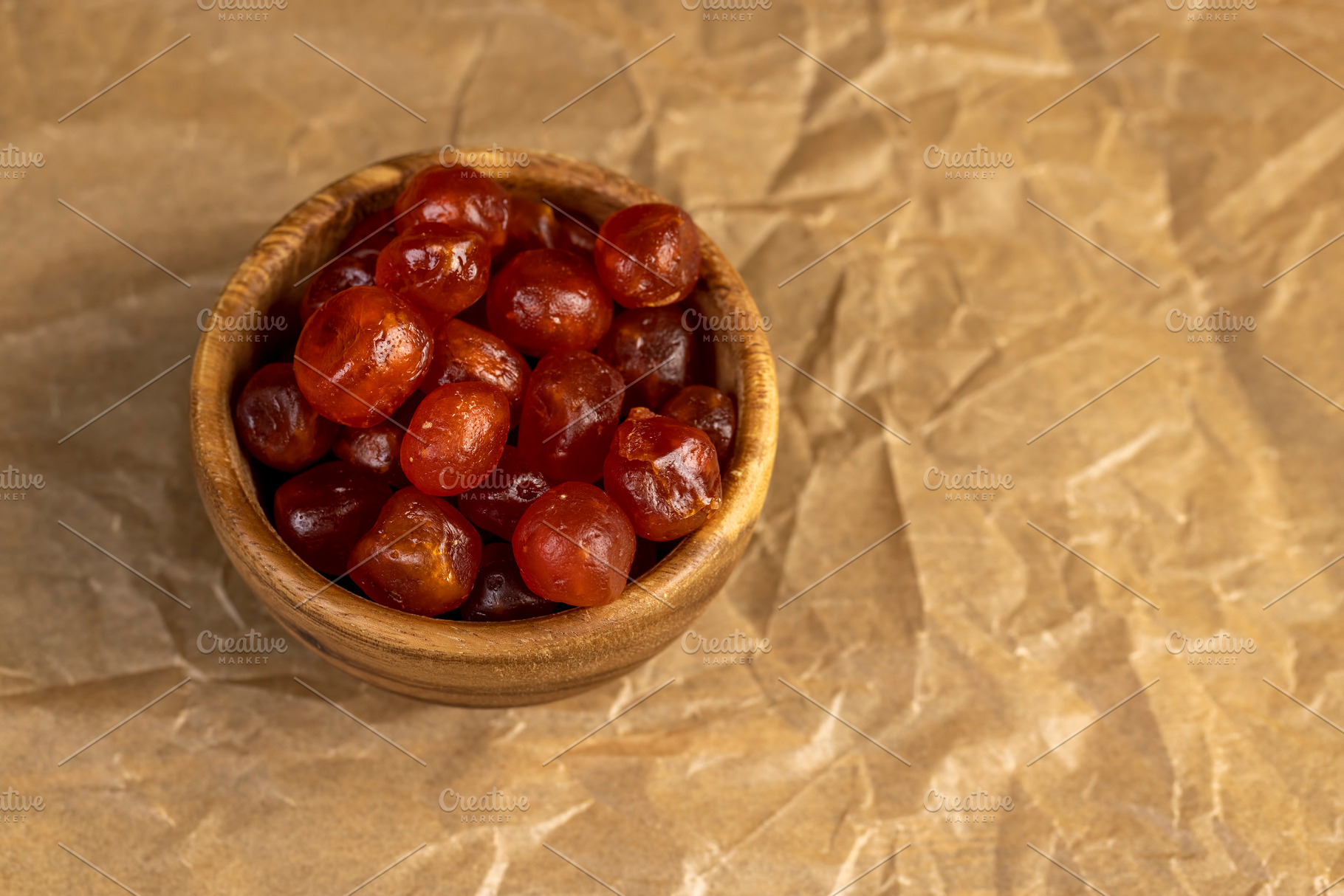 candied fruits of ripe orange kumquat, boiled with sugar syrup candied fruits o, a Photo by rsoollAI