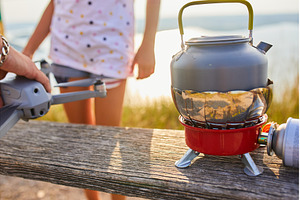 Outdoor cooking setup with portable, a Nature Photo by IlliaBondarPhotography