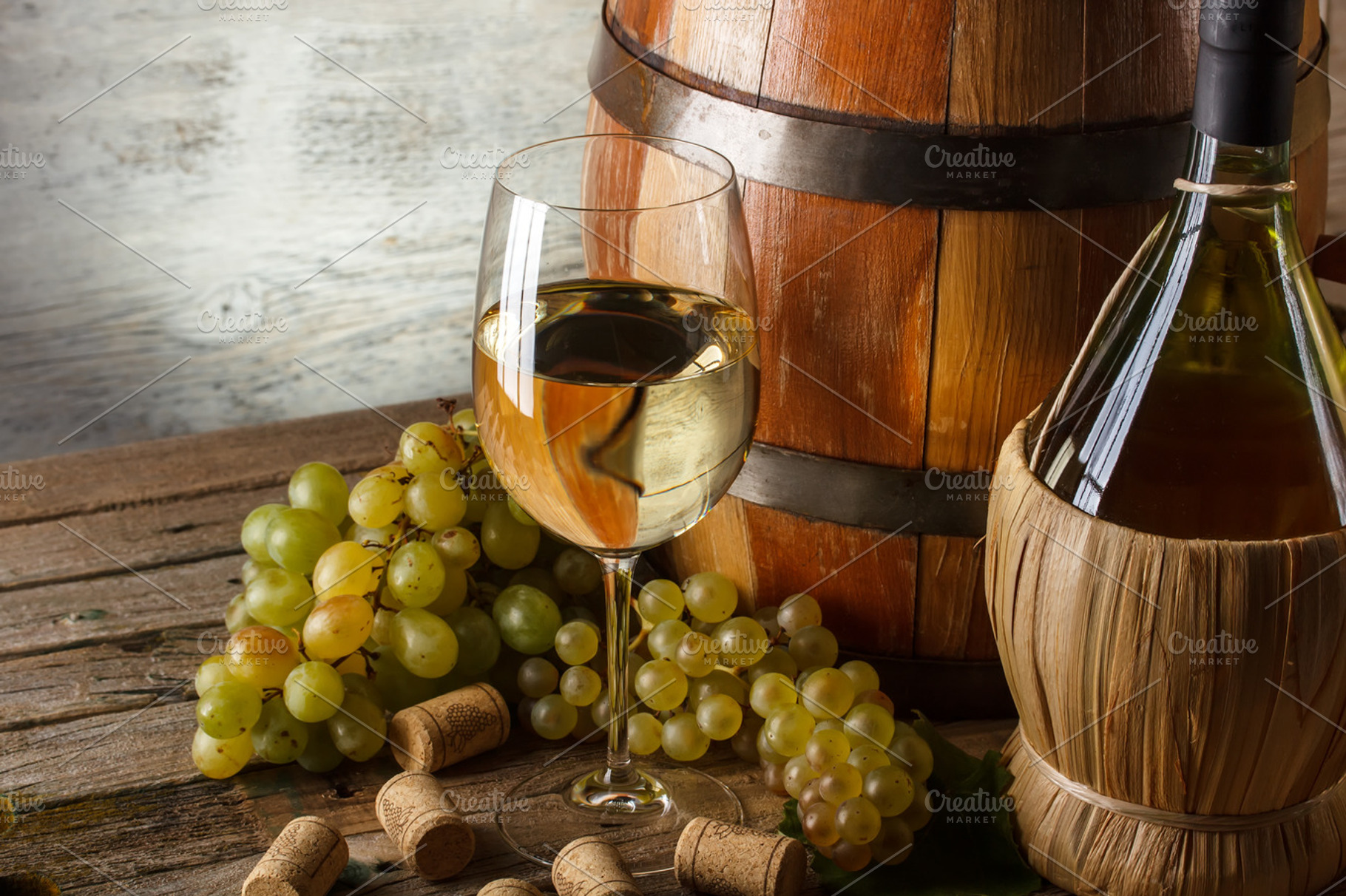 Wine concept containing wine, barrel, and table