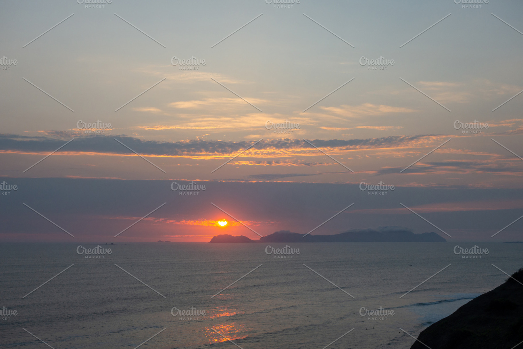 Sunset over the bay and Isla San Lorenzo in Lima, Peru, a Photo by GoodGoods