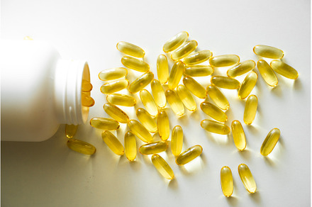 Open bottle with omega-3 capsules, a Health & Medical Photo by volodymyrshtun13795
