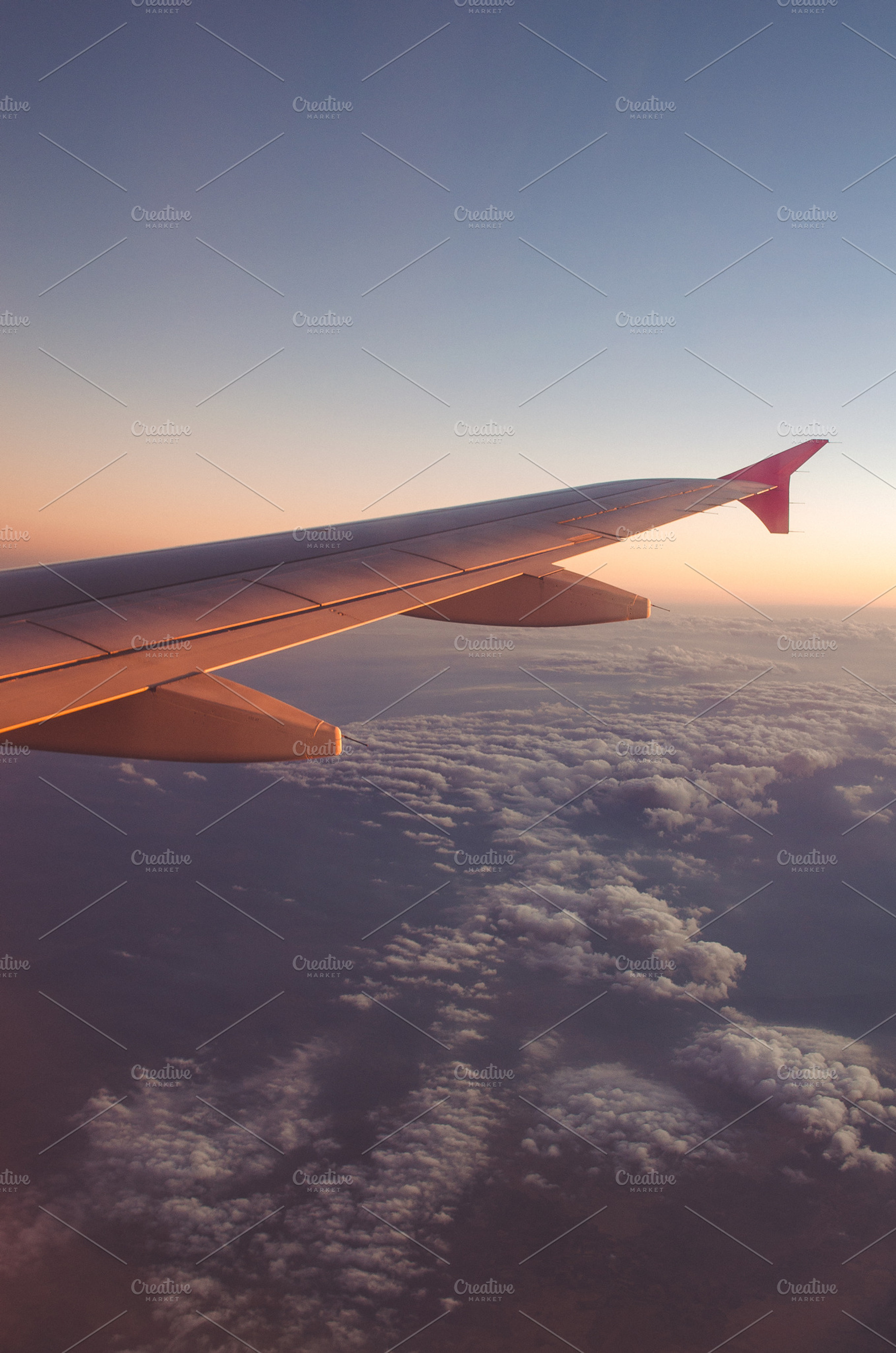 Airplane wing with sunrise featuring above, aircraft, and airplane, a Transportation Photo by Alexandrulucian