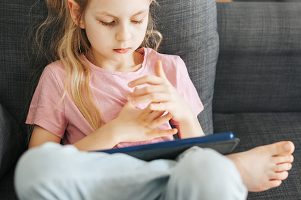 Little girl with  tablet  at home, a Person Photo by Olena Rudo