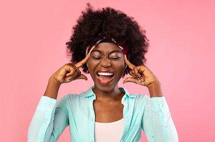 Emotional African Woman Shouting Touching Temples Posing On Pink Background, a Background Photo by Prostock-Studio