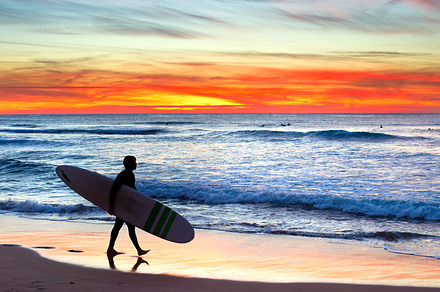 Silhouette of a surfer at sunset, a Sports & Recreation Photo by joyt