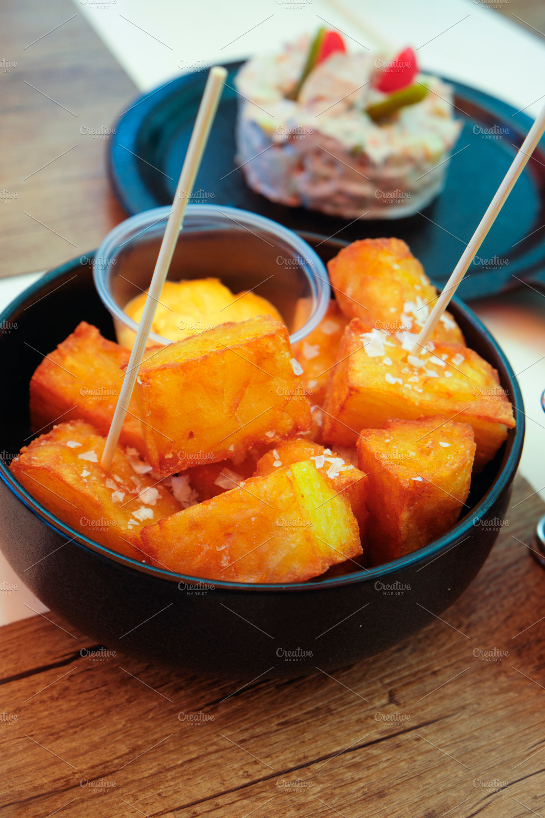 spanish patatas bravas and ensaladilla rusa, a Photo by Nito