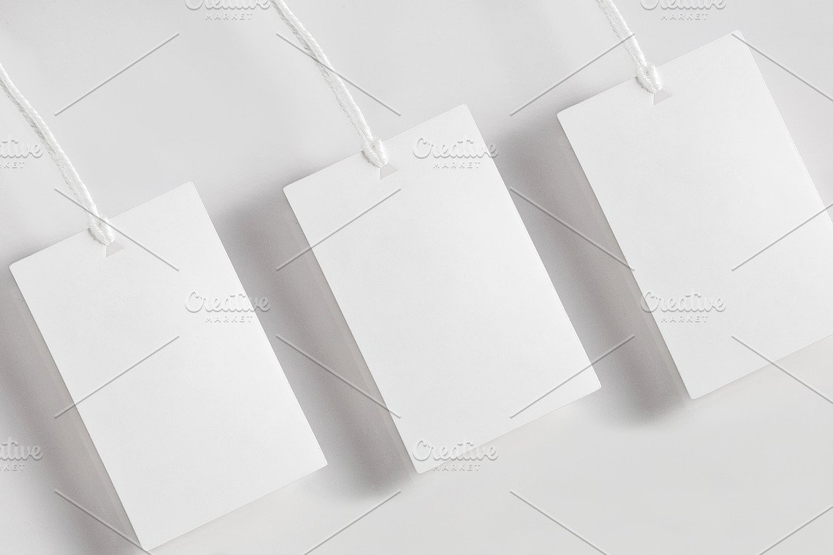Clothes label tag blank white mockup, an Advertising Mockup by Olha Klein (Photo 2 of 3)