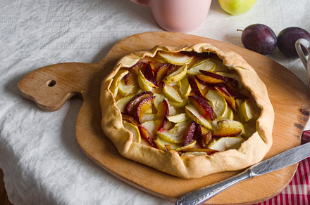 Homemade apple and plum galette table for teatime, a Food & Drink Photo by vimart