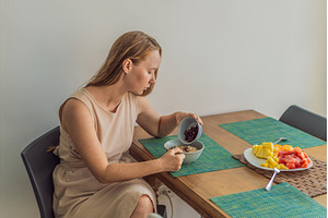 Woman enjoying a peaceful breakfast, a Person Photo by Elizaveta Galitskaya