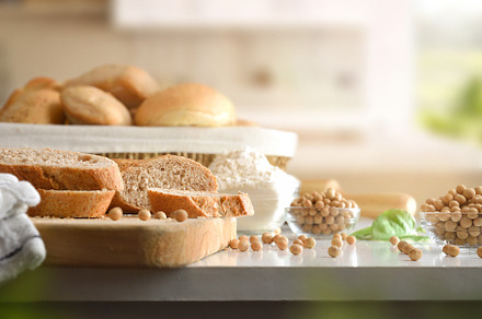 Soy flour bread slices on cutting board on kitchen bench, a Food & Drink Photo by Davizro's Market