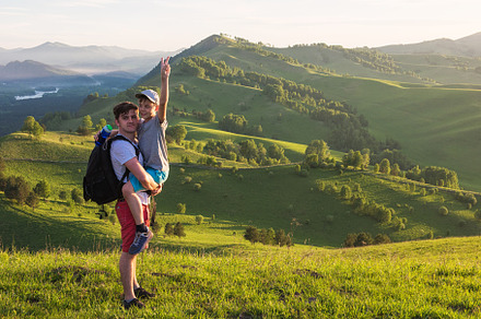 Happy father and son in the altai mountains containing boy, child, and dad, a Person Photo by Jan Jack Russo Media