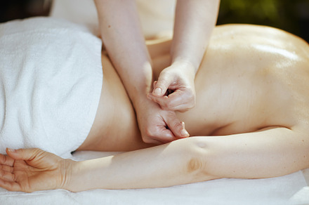 Closeup on medical massage therapist do therapeutic massage, a Health & Medical Photo by Alliance Images
