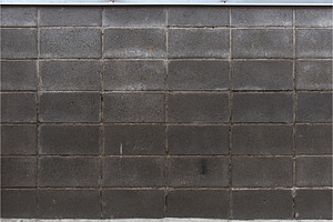 Masonry wall made of gray containing stone, abstract, and architecture