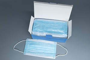 Box of disposable blue medical face masks on a grey background. Open cardboard, a Health & Medical Photo by Rohan Photography