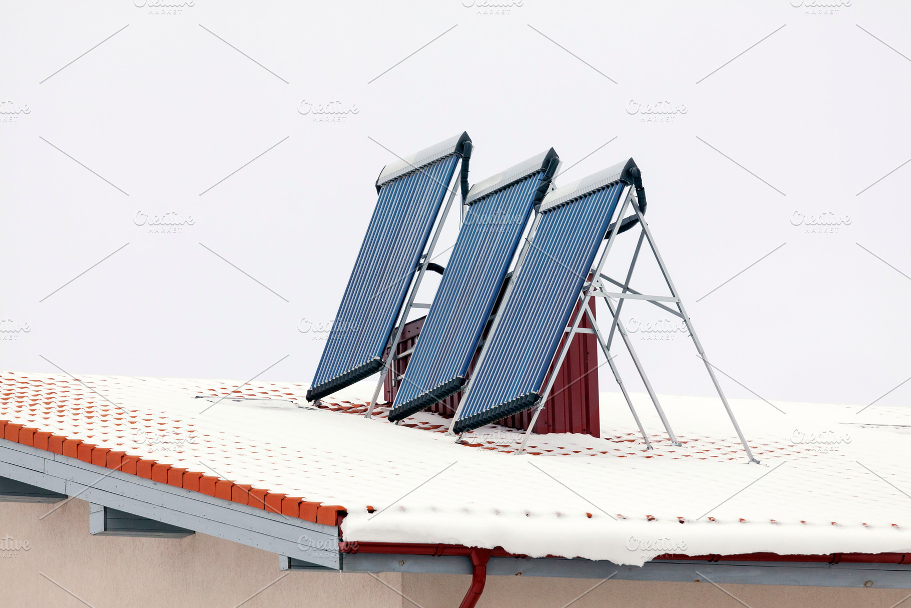 Roof in winter with solar panels, a Technology Photo by BOOCYS