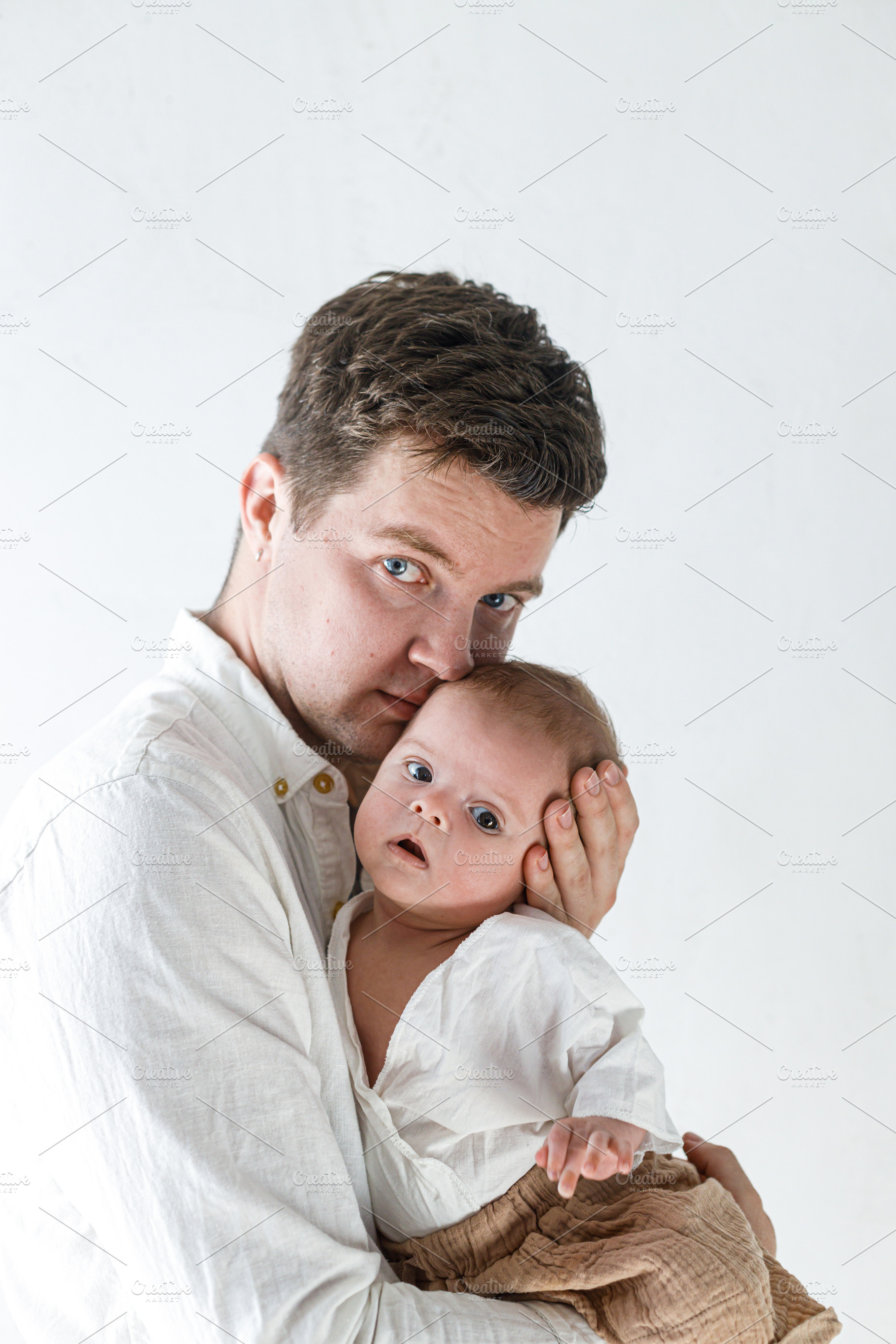Happy Fathers day! Stylish father hugging little baby son close, a Person Photo by Sonjachni