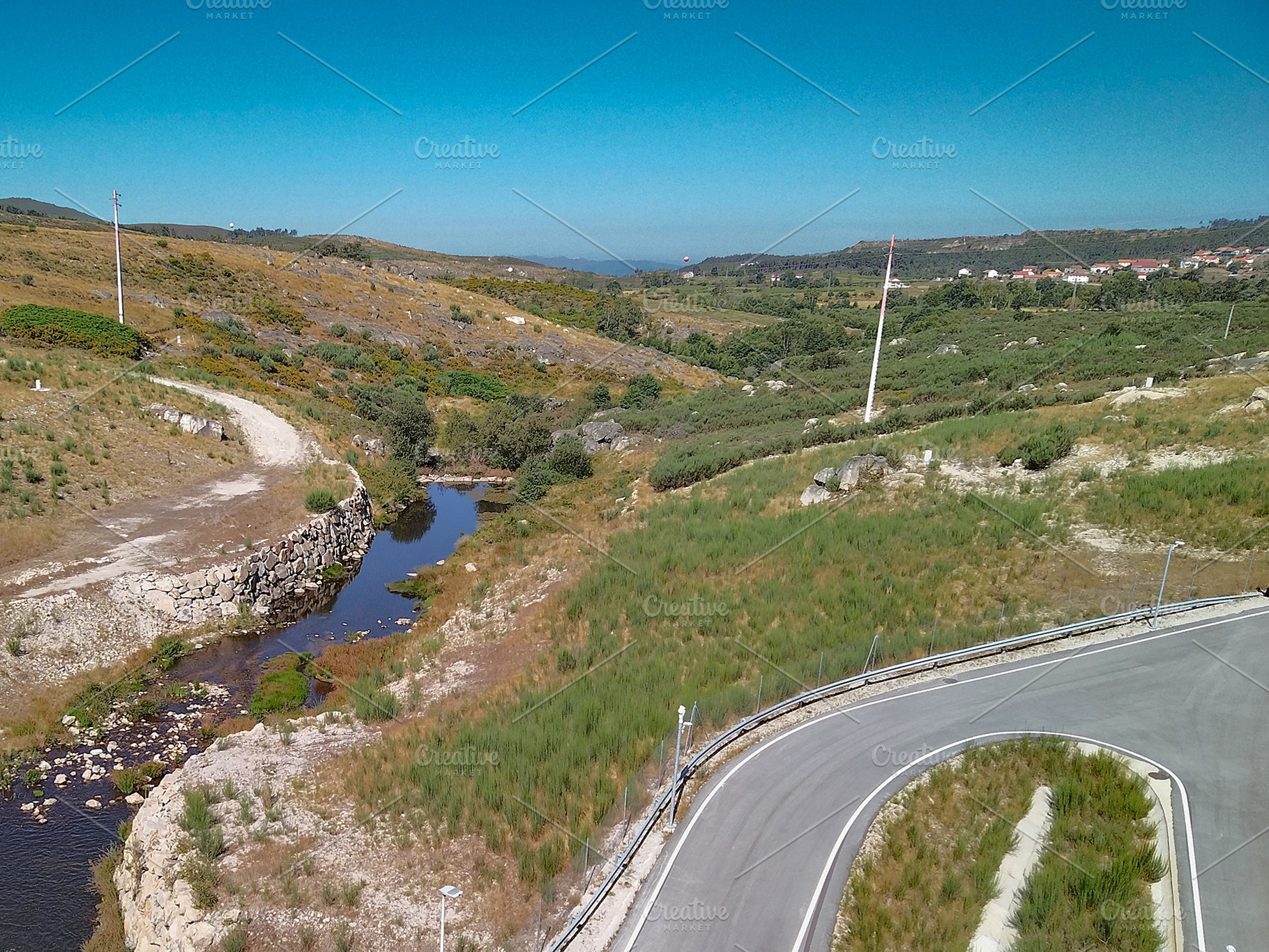 Curved road in dry rural landscape, a Nature Photo by DanFLCreativo