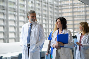 Team of doctors discussing test, a Graphic by HalfPoint
