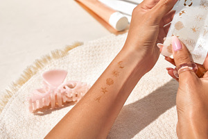 Temporary sun tan tattoos on forearm, a Photo by Dvoevnore photos