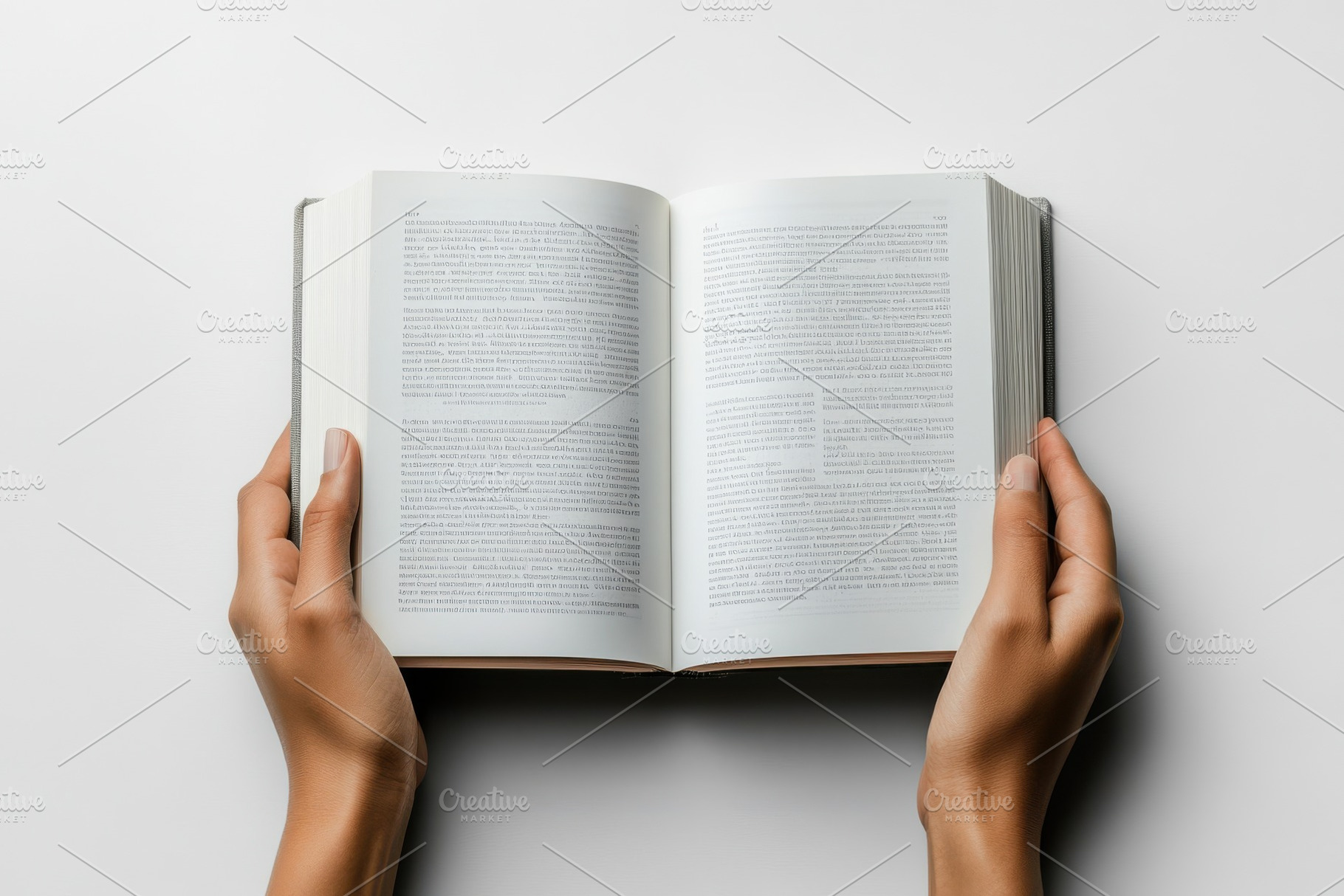 Hands holding open book reading text, a Background Photo by Pixeness Studio