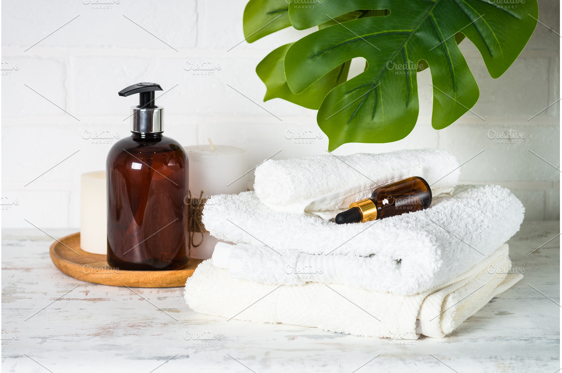 Bottle of soap and stack of towels, a Health & Medical Photo by Nadia-nb