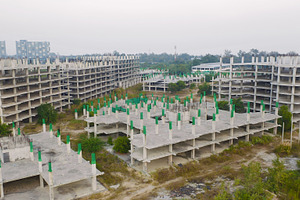 Aerial top view of abandoned apartment or hotel under constructi