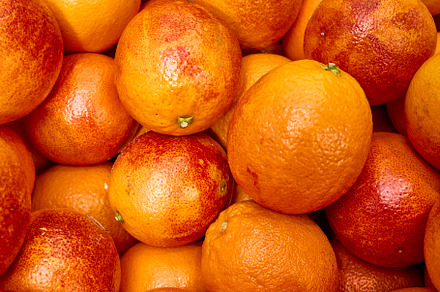 Fresh Blood Oranges in a Market Disp