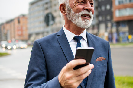 Senior businessman on street, a Person Photo by REDDOT Studio