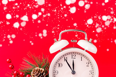 Festive composition with pine branch, alarm clock and candle number 2022, red b, a Holiday Photo by iuliia_n