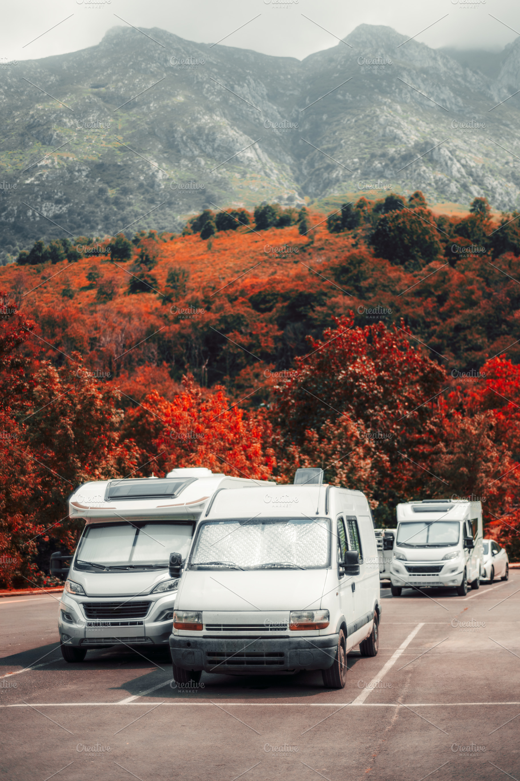 Camper vans in autumn mountains, a Transportation Photo by SkyNext