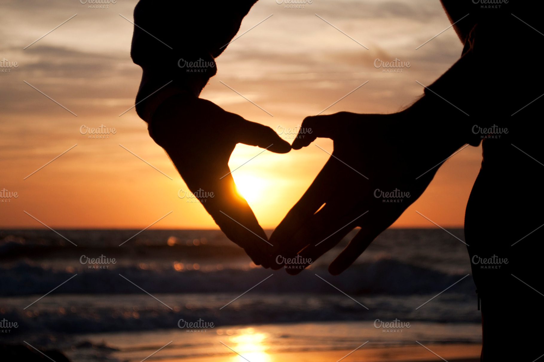 Hands forming a heart at the sunset containing sunset, heart, and love, a Person Photo by Irantzu Arbaizagoitia