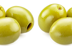Green olives on a white background, a Food & Drink Photo by Volff