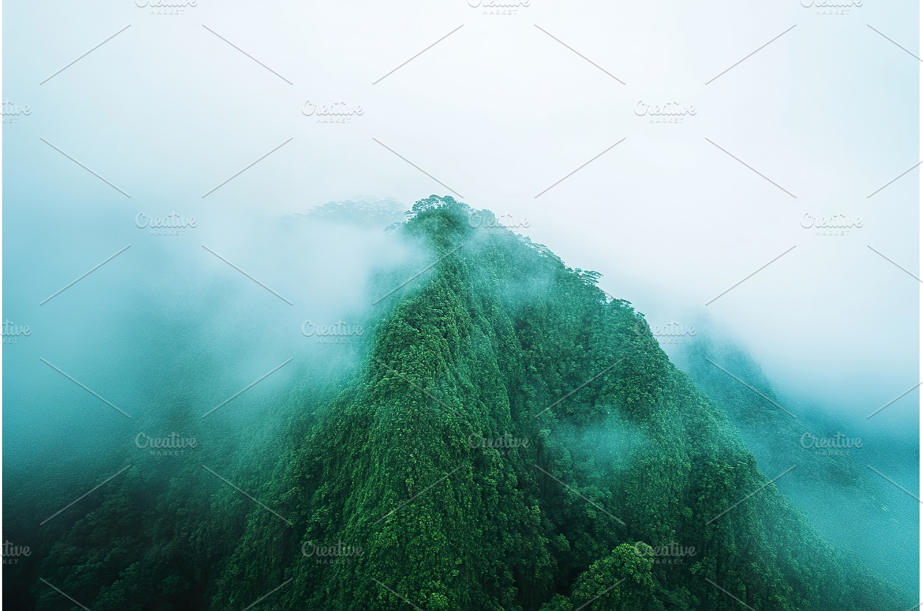 Lush Green Mountain Peak Obscured by, a Background Photo by Lermont51
