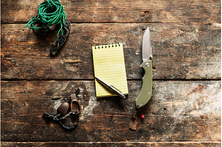 Yellow notebook and pen on the table