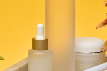 Various cosmetic bottles pipette, spray, jar, roller massager an