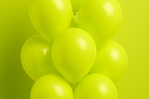 Chartreuse balloons cluster on lime, a Photo by Dvoevnore photos