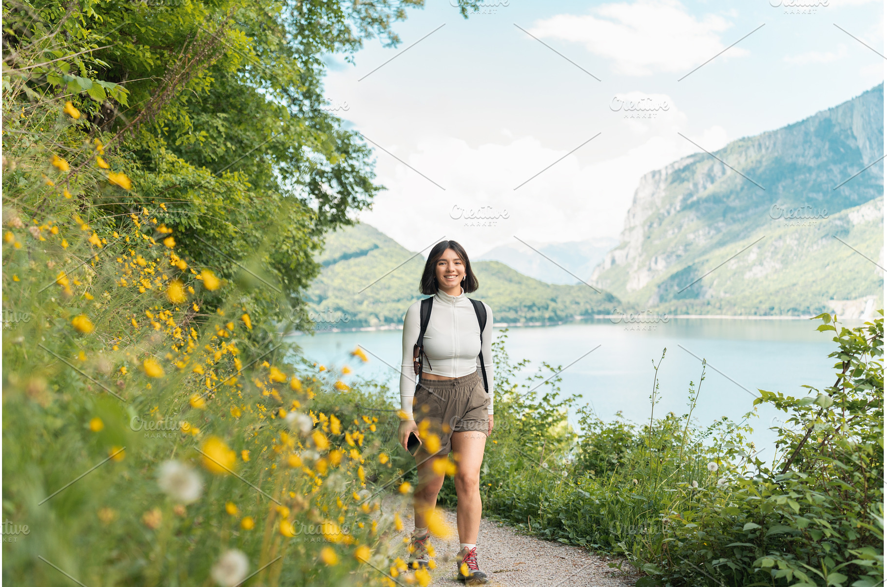 Glowing with joy, a woman strolls a, a Person Photo by AD Stock Images
