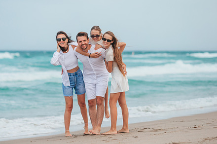 Young family on vacation have a lot of fun, a Person Photo by travnikovstudio