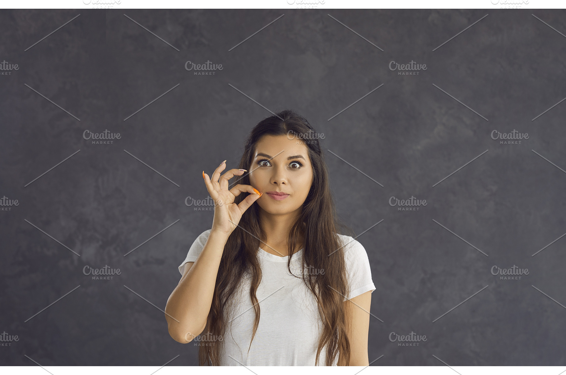 Portrait of young woman make gesture, a Person Photo by StudioRomantic