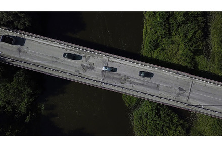 A long road with cars.Clip. A large, a Transportation Photo by Media Whale Stock