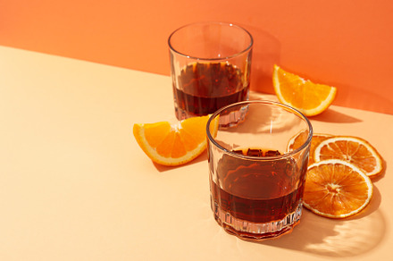 Concept of delicious alcohol drink, Whiskey with orange, a Food & Drink Photo by AtlasStudio PRO
