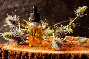 Jar of burdock oil spa selective focus space for text stock photo containing