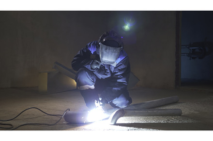 Man works with welding at, an Industrial Photo by Media Whale Stock