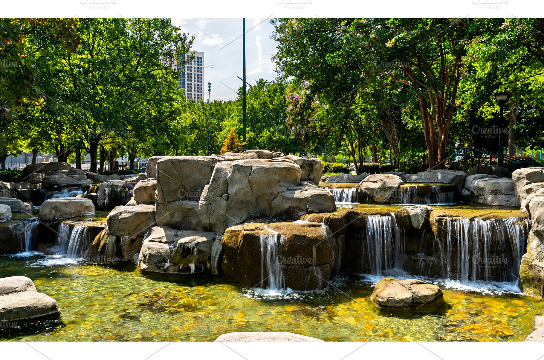 Artificial waterfall and rocks in, an Architecture Photo by Leonid Andronov