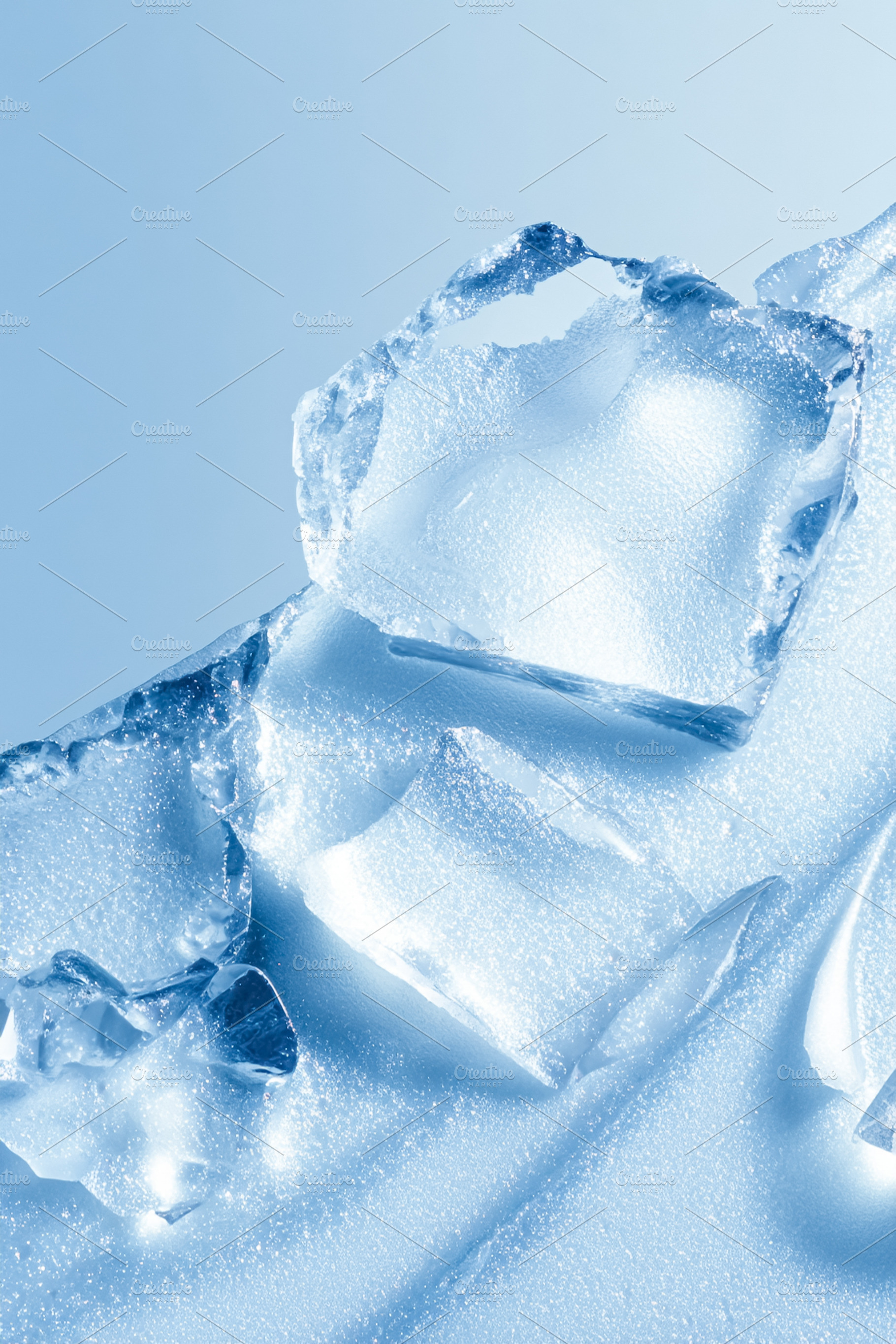 Broken ice pieces creating abstract frozen texture and cold blue, a Photo by Studio ANNA