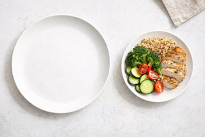 Healthy meal with chicken, quinoa, vegetables on white plate and, a Photo by Dvoevnore photos
